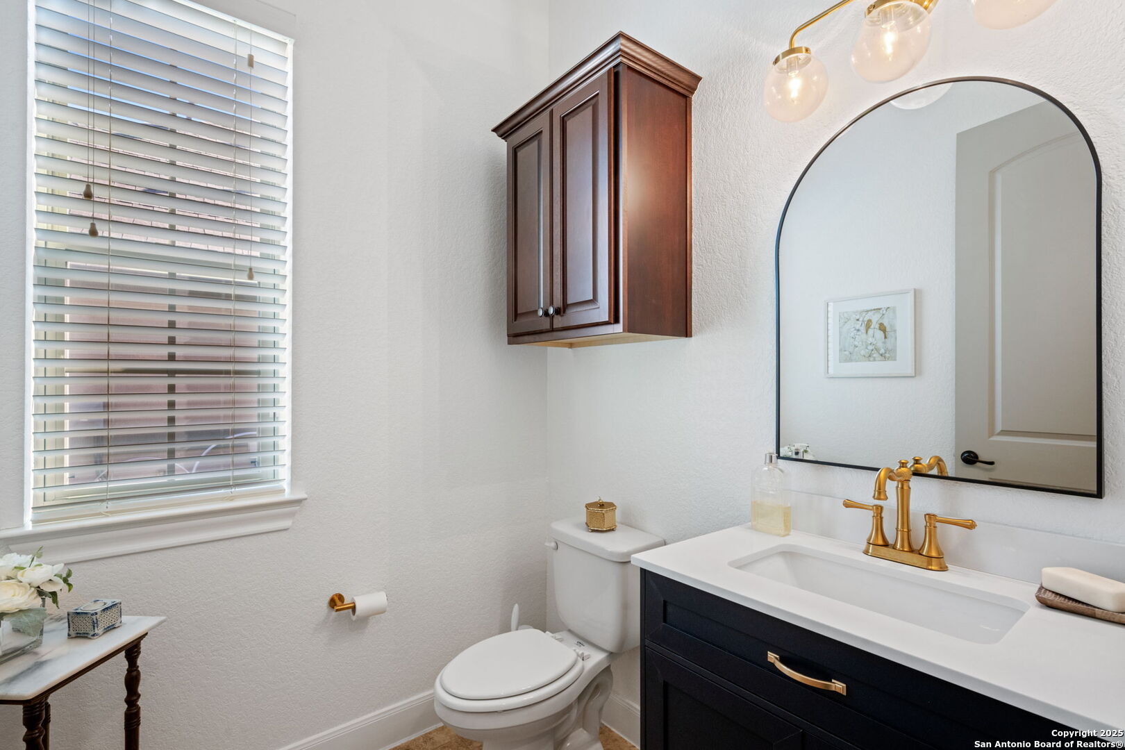 28827 Pfeiffers Gate Fair Oaks Ranch, TX 78015 - Photo 28 of 36 a bathroom with a sink a toilet and mirror