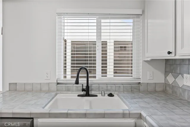 a kitchen with a window and sink
