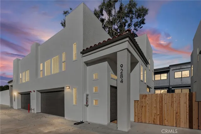 a front view of a house with a garage