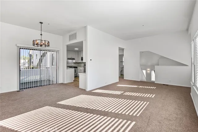 a view of a bedroom with wooden floor