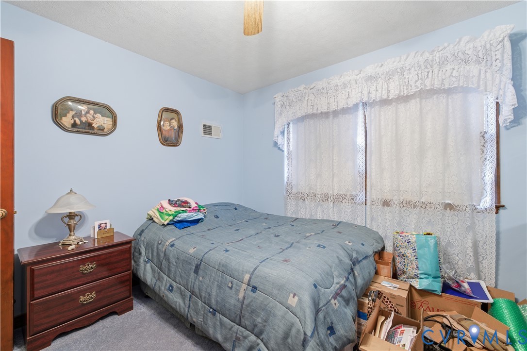 12508 Percival Street Chester, VA 23831 - Photo 16 of 30 a bedroom with a bed and a window