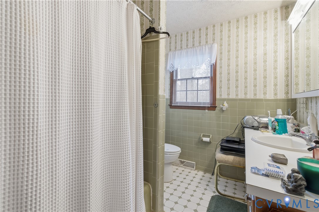 12508 Percival Street Chester, VA 23831 - Photo 20 of 30 a bedroom with a sink and a bed