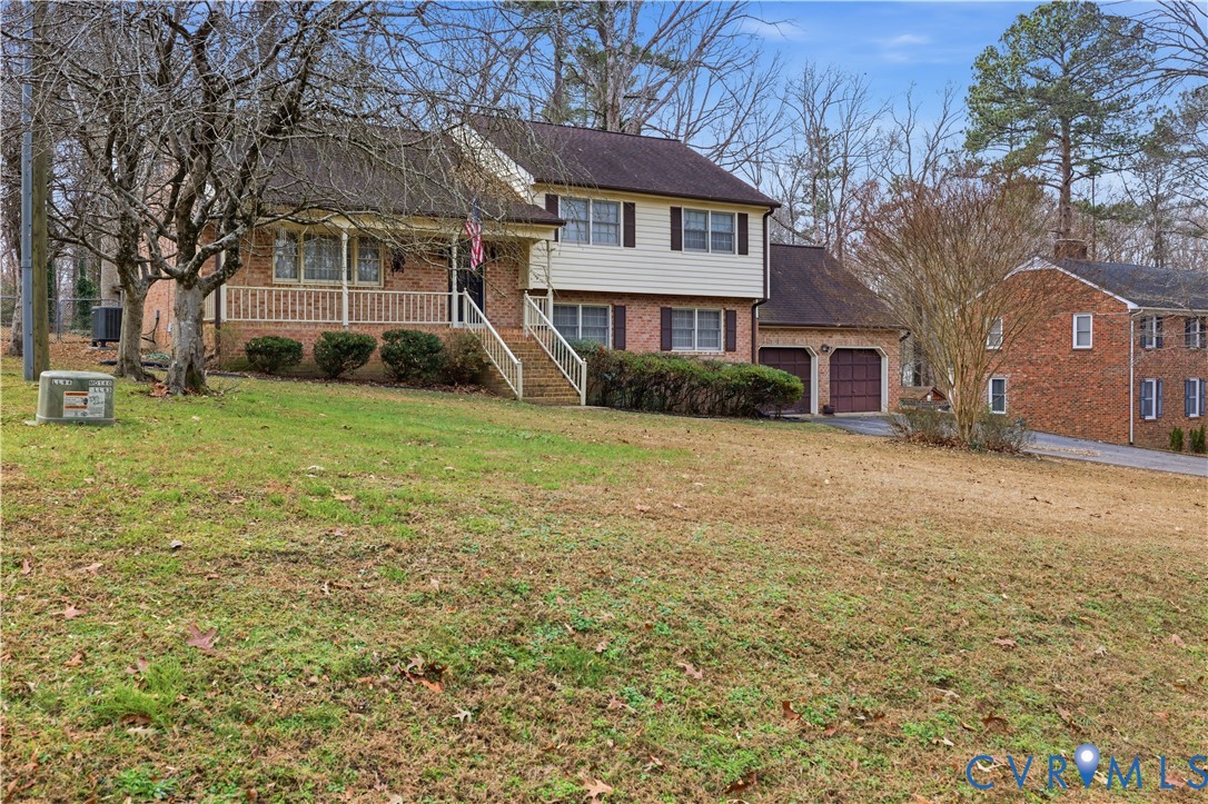 12508 Percival Street Chester, VA 23831 - Photo 3 of 30 a view of a house with a yard