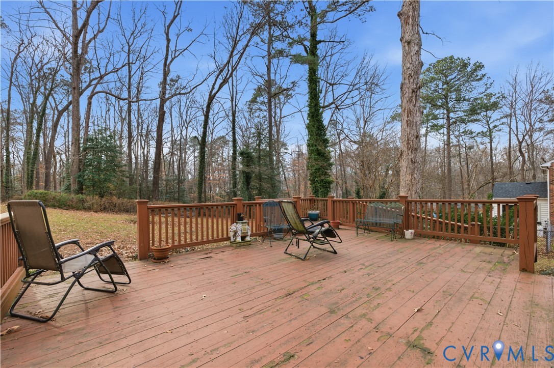 12508 Percival Street Chester, VA 23831 - Photo 4 of 30 a view of a chair and table on the wooden floor