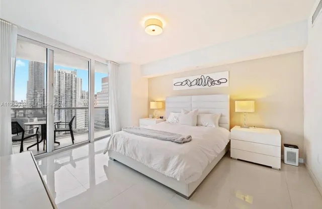 a bedroom with a bed and a table