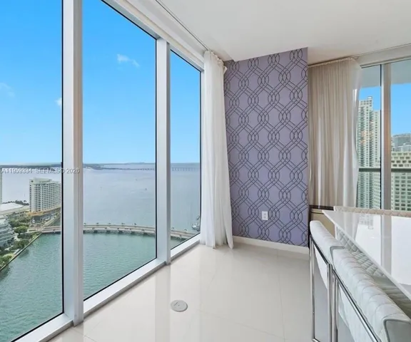 a view of a bathroom with a tub and shower