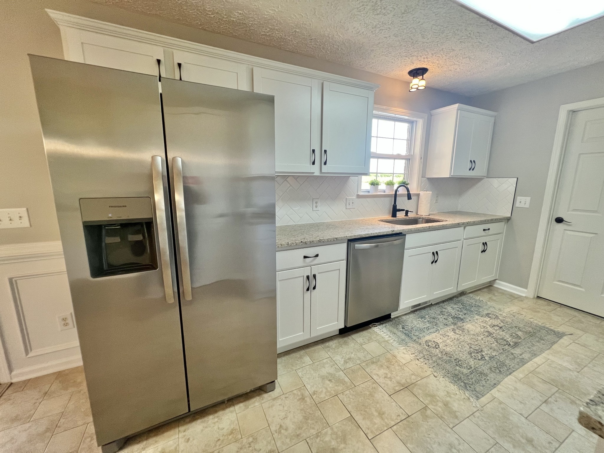 5345 Ashburn Road Springfield, TN 37172 - Photo 27 of 46 a kitchen with stainless steel appliances granite countertop a refrigerator a sink and white cabinets