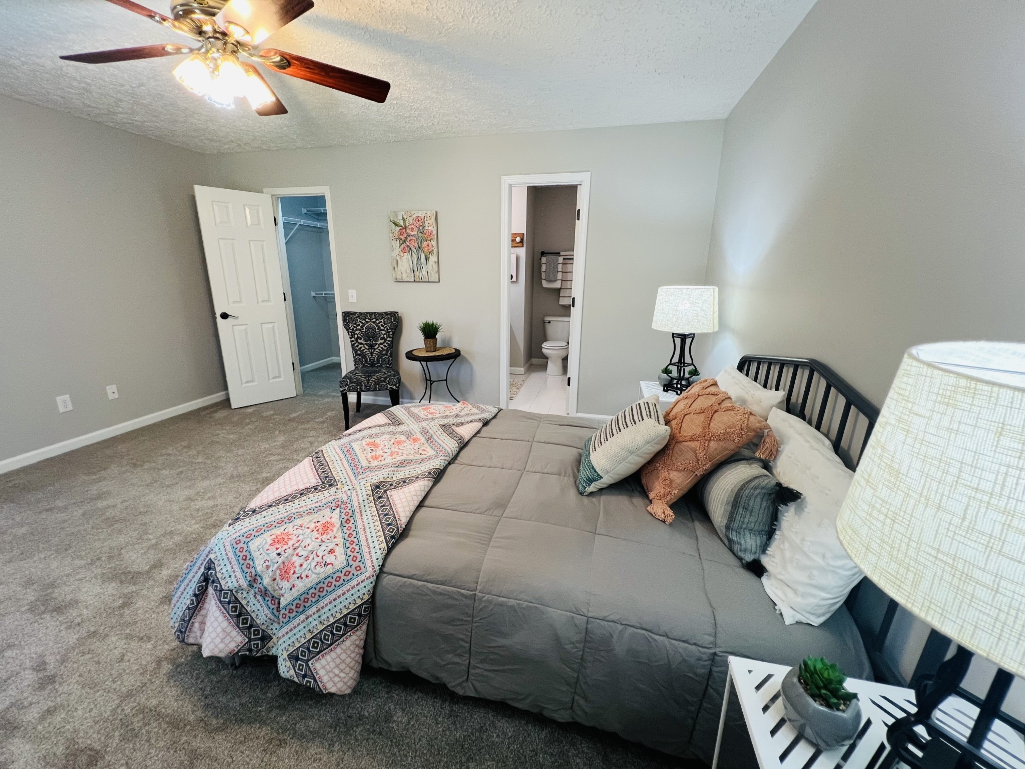 5345 Ashburn Road Springfield, TN 37172 - Photo 32 of 46 a bedroom with a bed and a chandelier