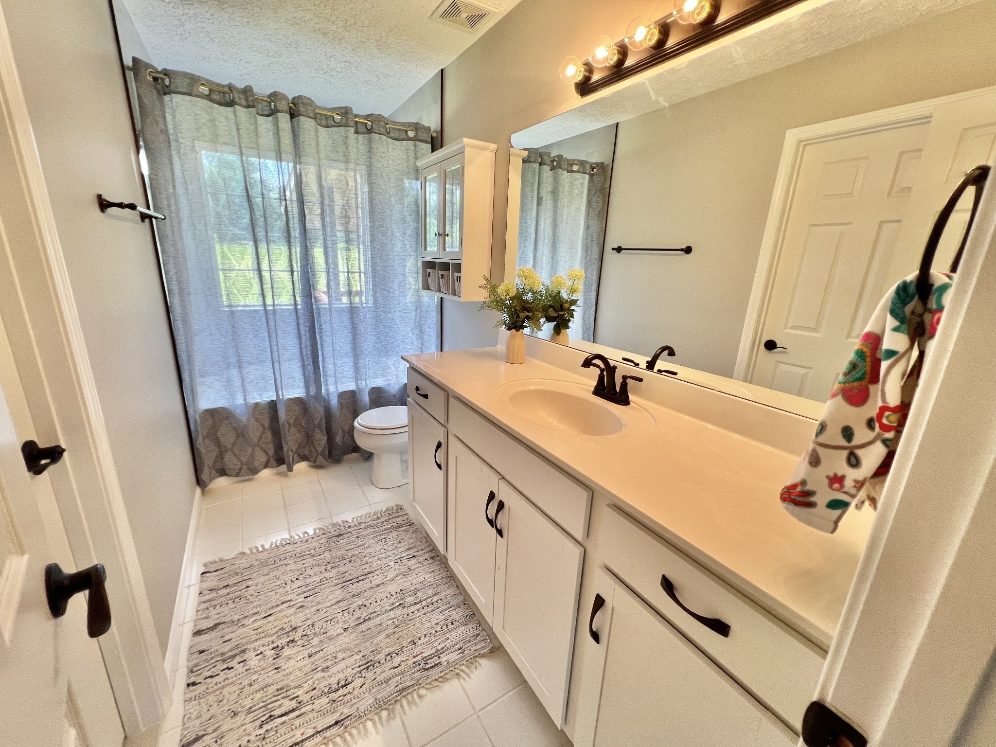 5345 Ashburn Road Springfield, TN 37172 - Photo 10 of 46 a bathroom with a double vanity sink and a mirror