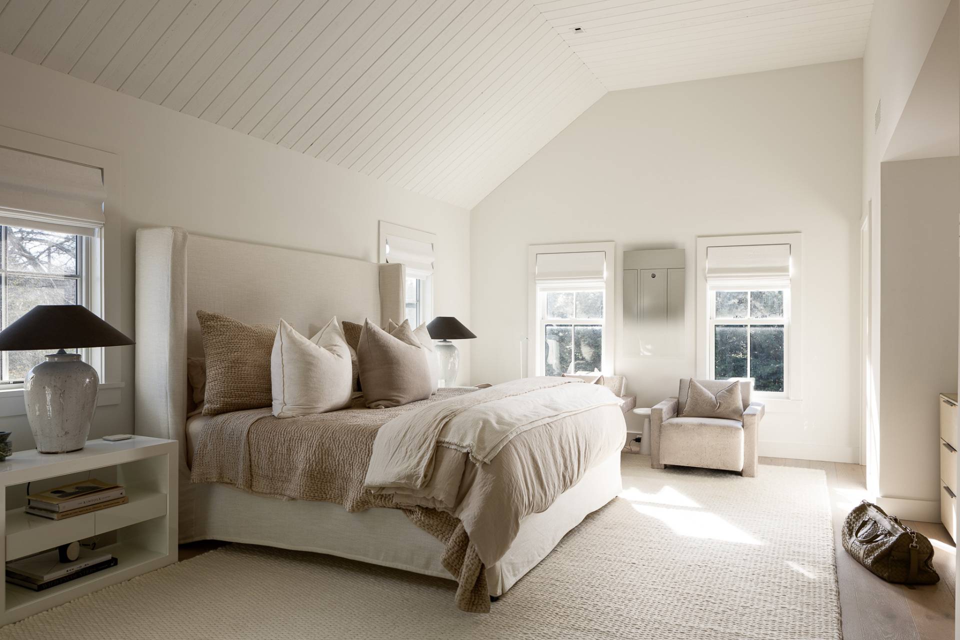 110 Ferry Road Sag Harbor, NY 11963 - Photo 14 of 17 a bedroom with a bed and ceiling fan