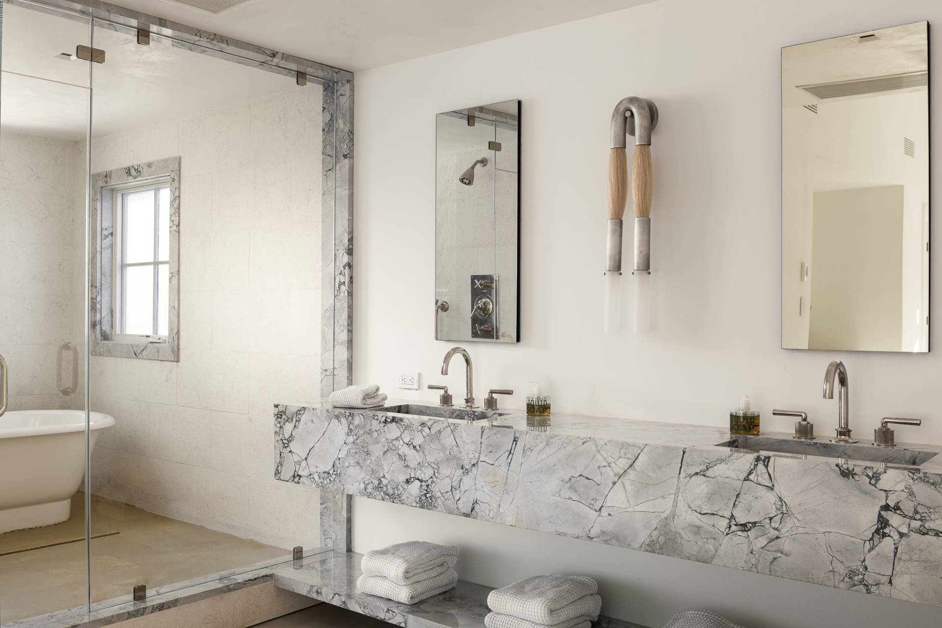 110 Ferry Road Sag Harbor, NY 11963 - Photo 16 of 17 a bathroom with a granite countertop sink and a mirror