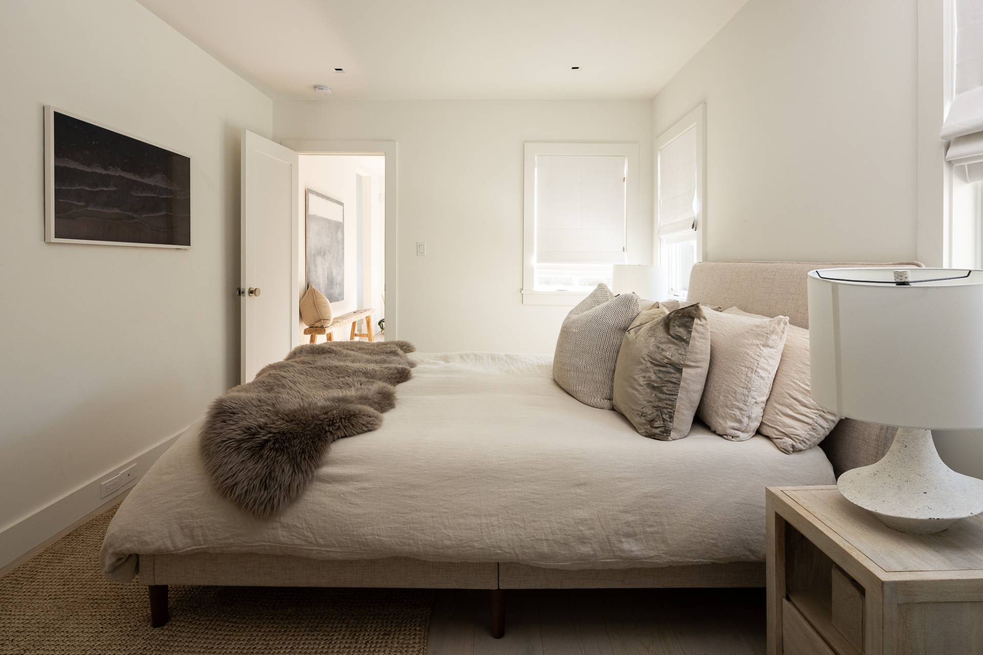 110 Ferry Road Sag Harbor, NY 11963 - Photo 2 of 17 a bedroom with a bed and a flat screen tv