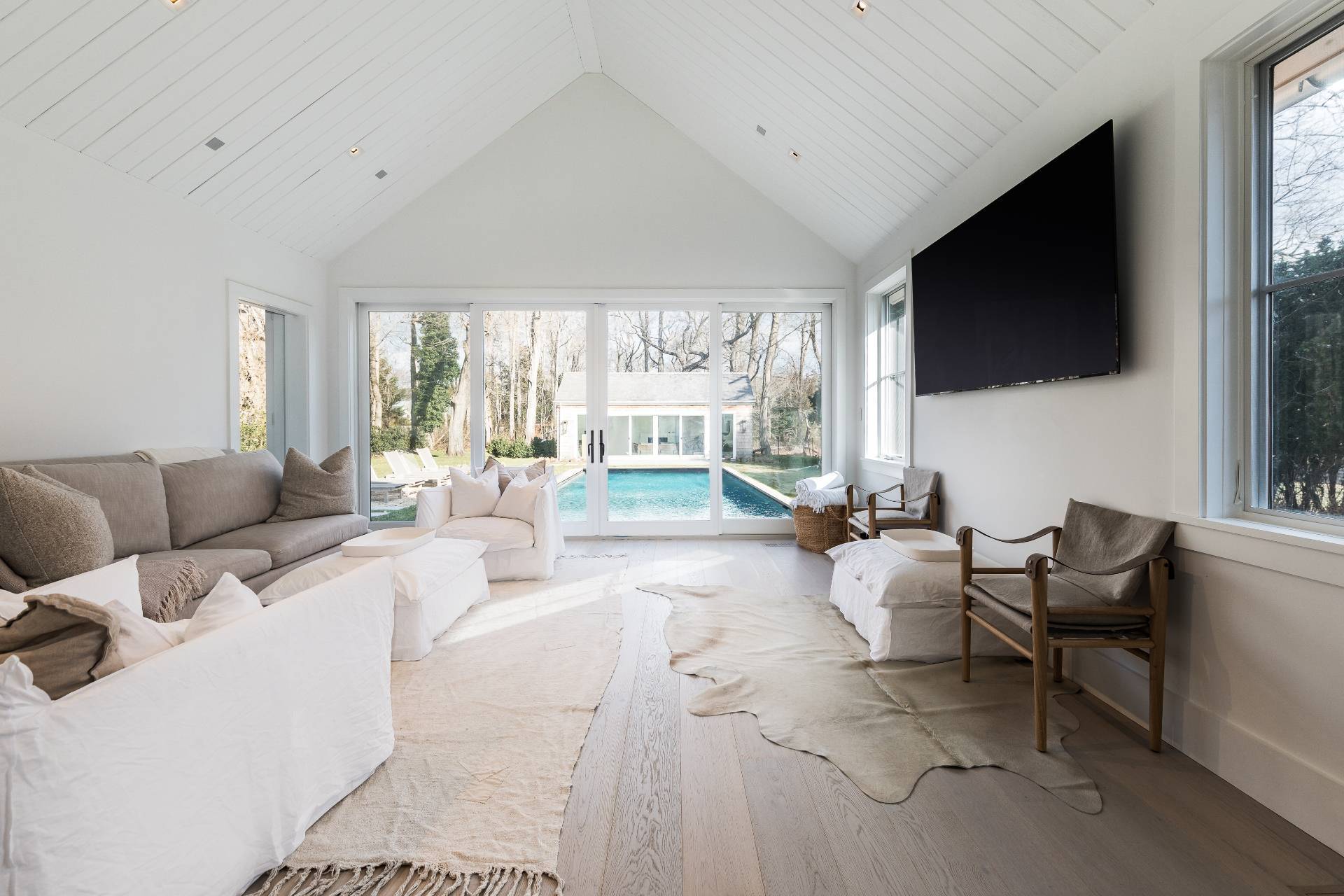 110 Ferry Road Sag Harbor, NY 11963 - Photo 4 of 17 a living room with fireplace furniture and a flat screen tv