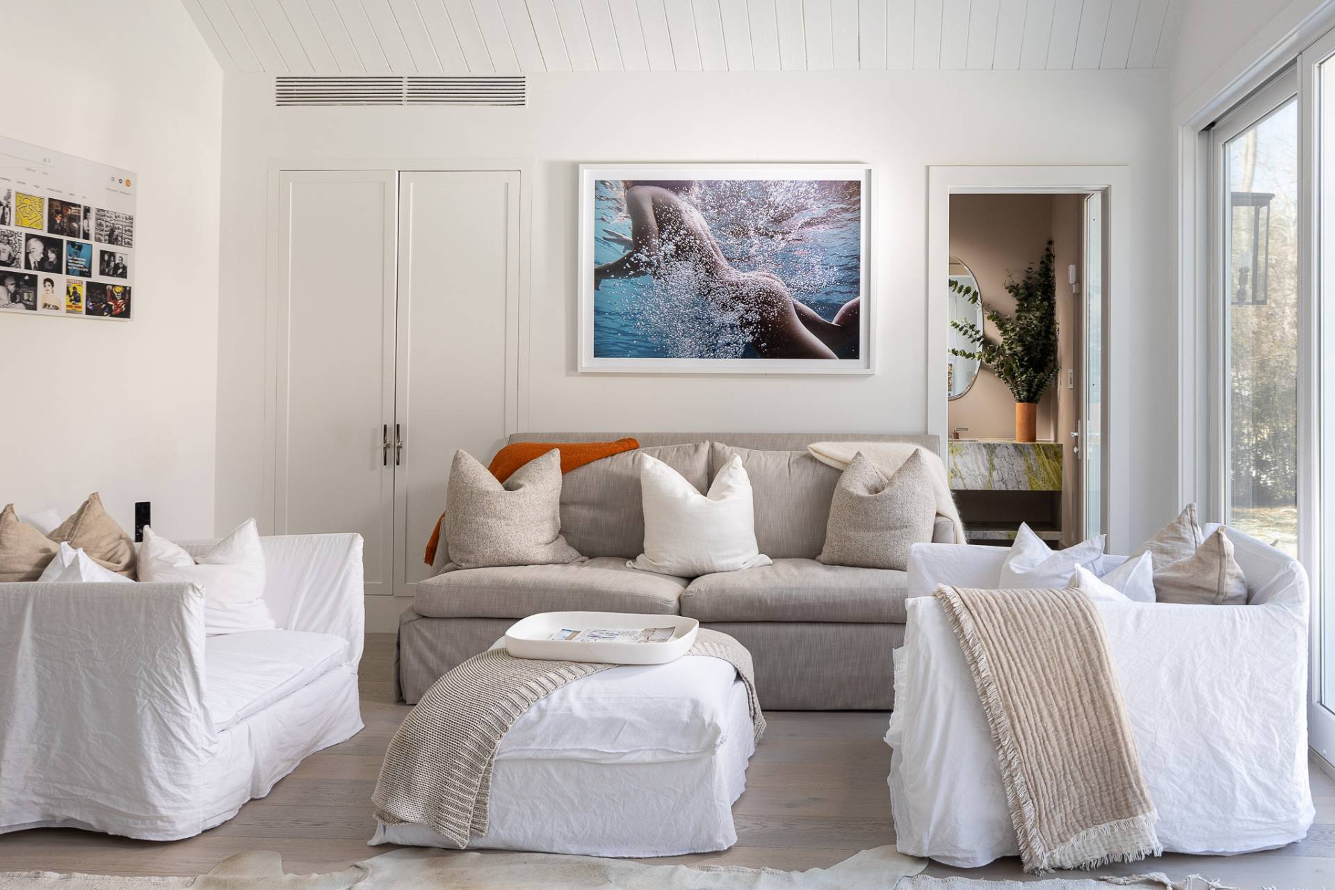 110 Ferry Road Sag Harbor, NY 11963 - Photo 5 of 17 a living room with furniture and a night stand