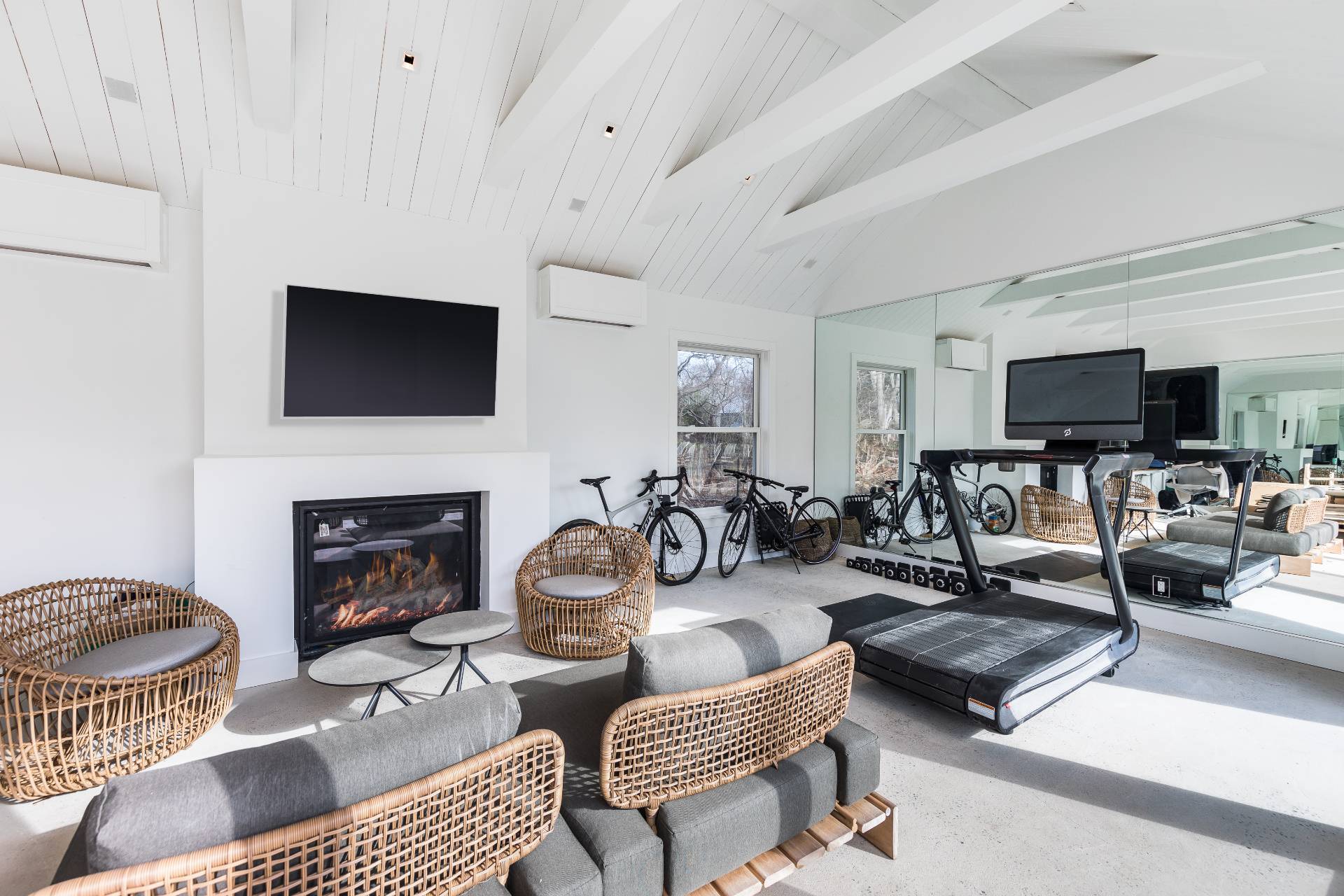 110 Ferry Road Sag Harbor, NY 11963 - Photo 7 of 17 a living room with furniture a fireplace and a flat screen tv