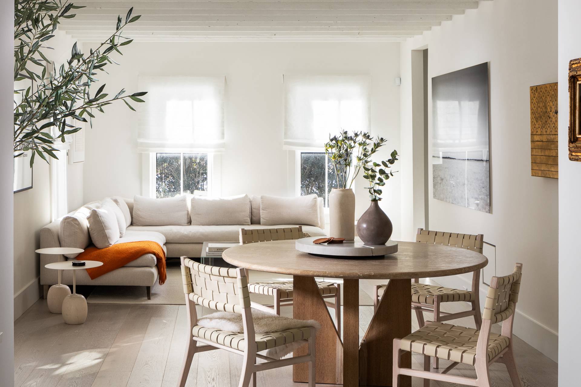 110 Ferry Road Sag Harbor, NY 11963 - Photo 10 of 17 a living room with furniture a chandelier and a window