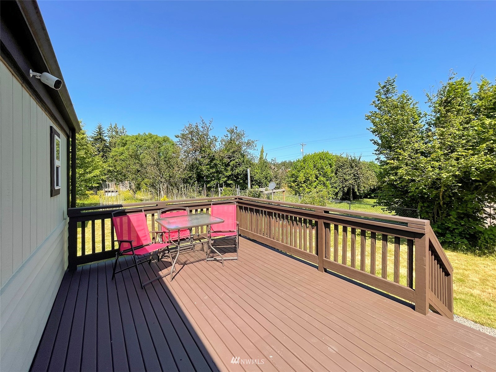 141 Streit Road Sequim, WA 98382 - Photo 33 of 40 a balcony with wooden floor and outdoor space