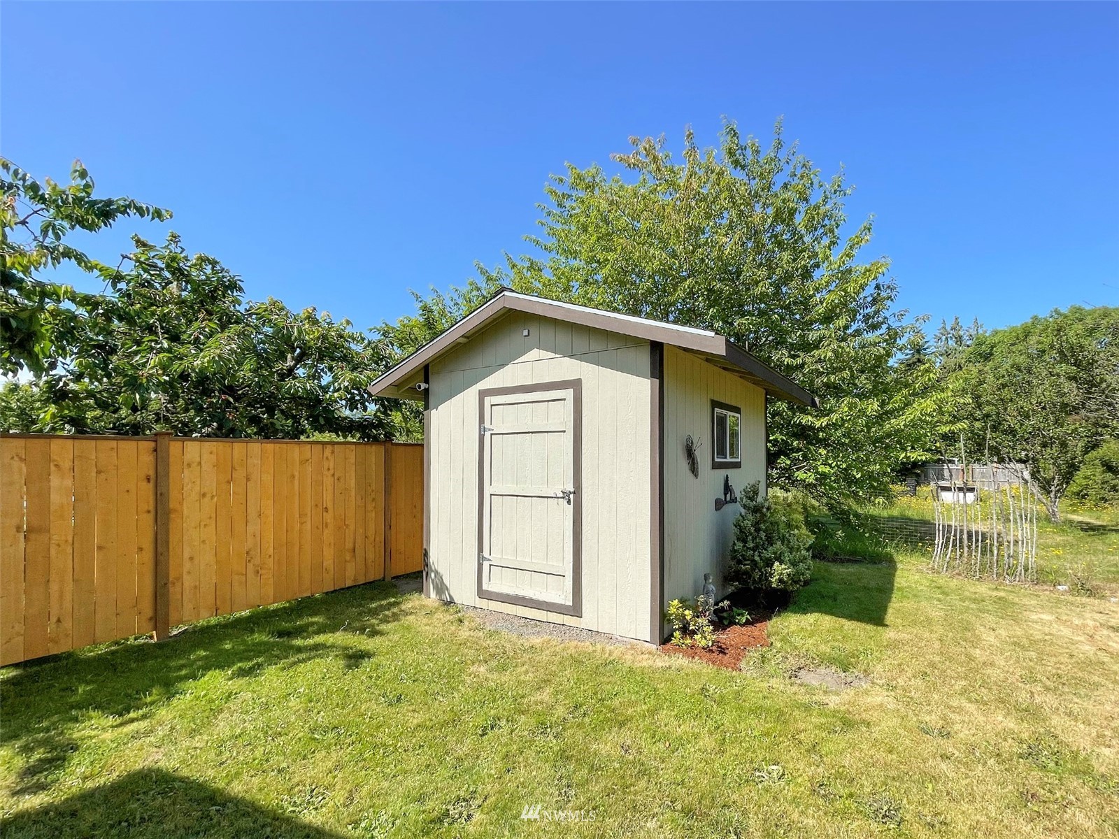 141 Streit Road Sequim, WA 98382 - Photo 36 of 40 a view of backyard with tub and trees around