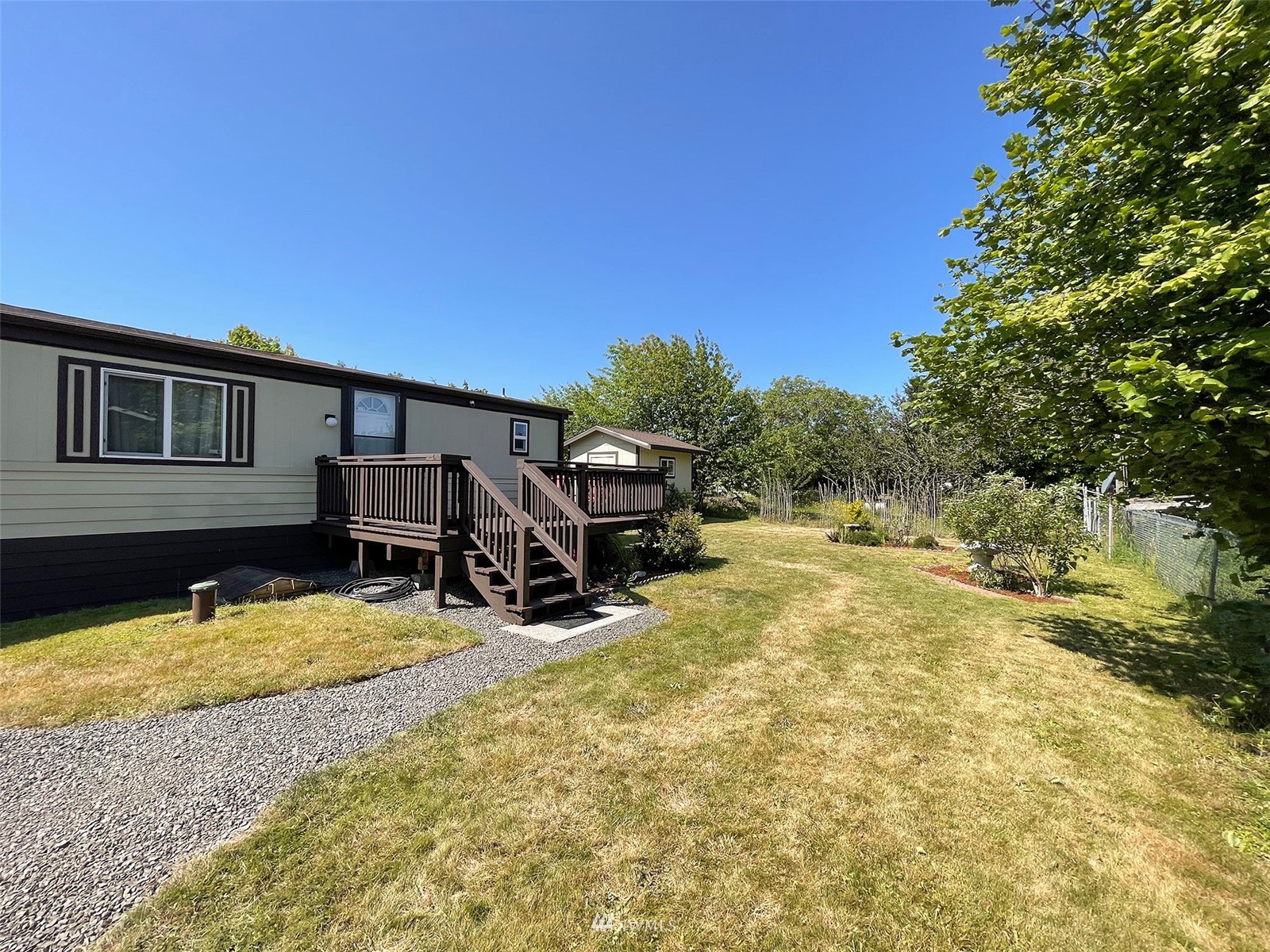 141 Streit Road Sequim, WA 98382 - Photo 6 of 40 a view of swimming pool with chair and porch