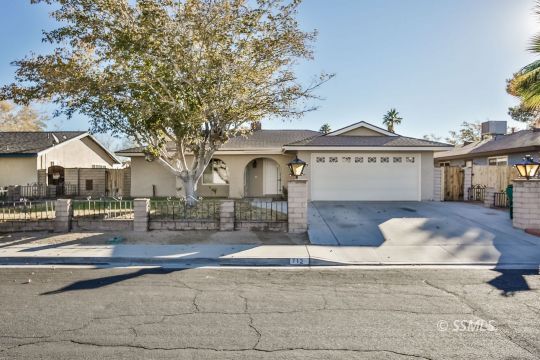 712 South Alvord Street Ridgecrest, CA 93555 - Photo 33 of 33 a front view of a house with a yard