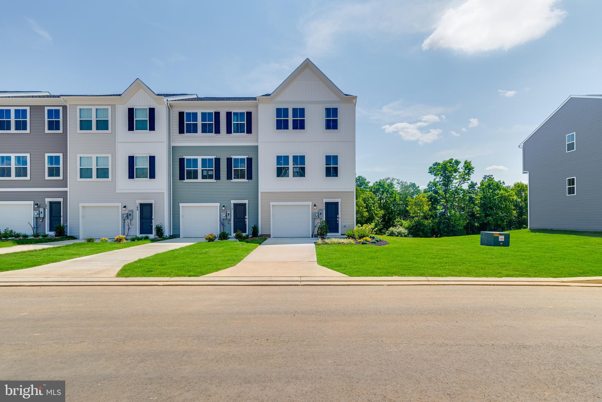 93 Gray Silver Road, Unit HARRIETT Inwood, WV 25428 - Photo 27 of 28 a house with outdoor space and garden