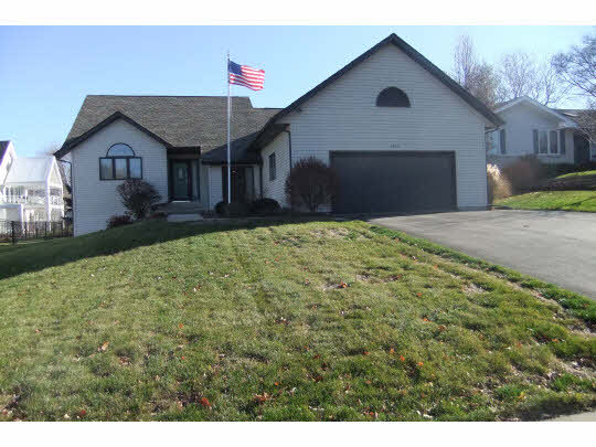 3433 Deer Path Road Rockford, IL 61114 - Photo 1 of 11 a front view of a house with garden