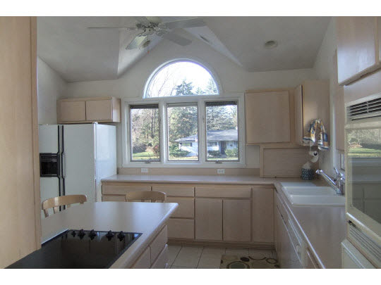 3433 Deer Path Road Rockford, IL 61114 - Photo 6 of 11 a kitchen with a window a sink and a refrigerator