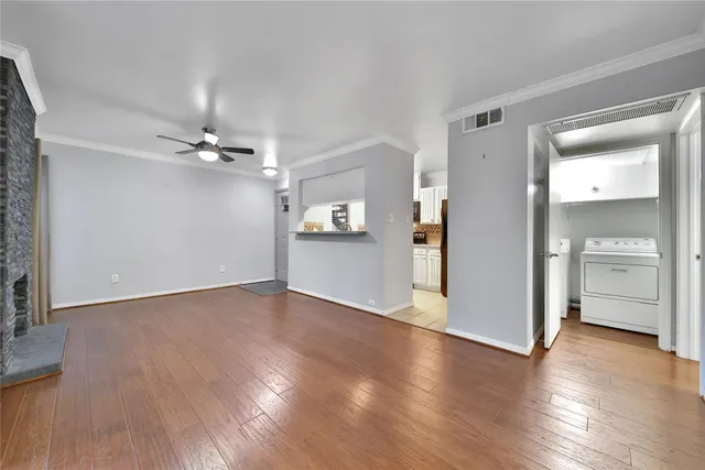 a view of a livingroom with wooden floor