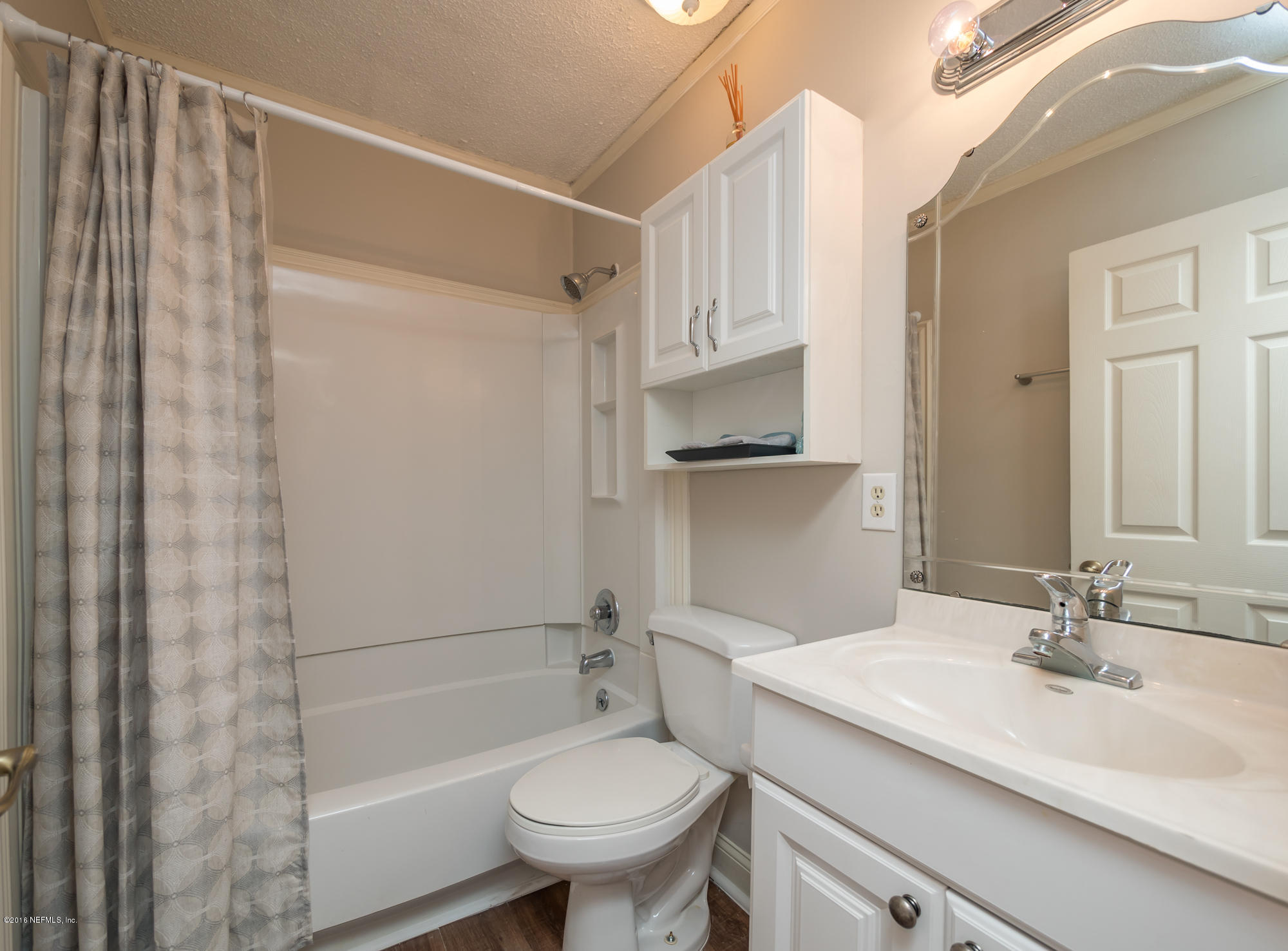 1804 Mayfair Road Jacksonville, FL 32207 - Photo 17 of 26 a bathroom with a sink toilet and shower