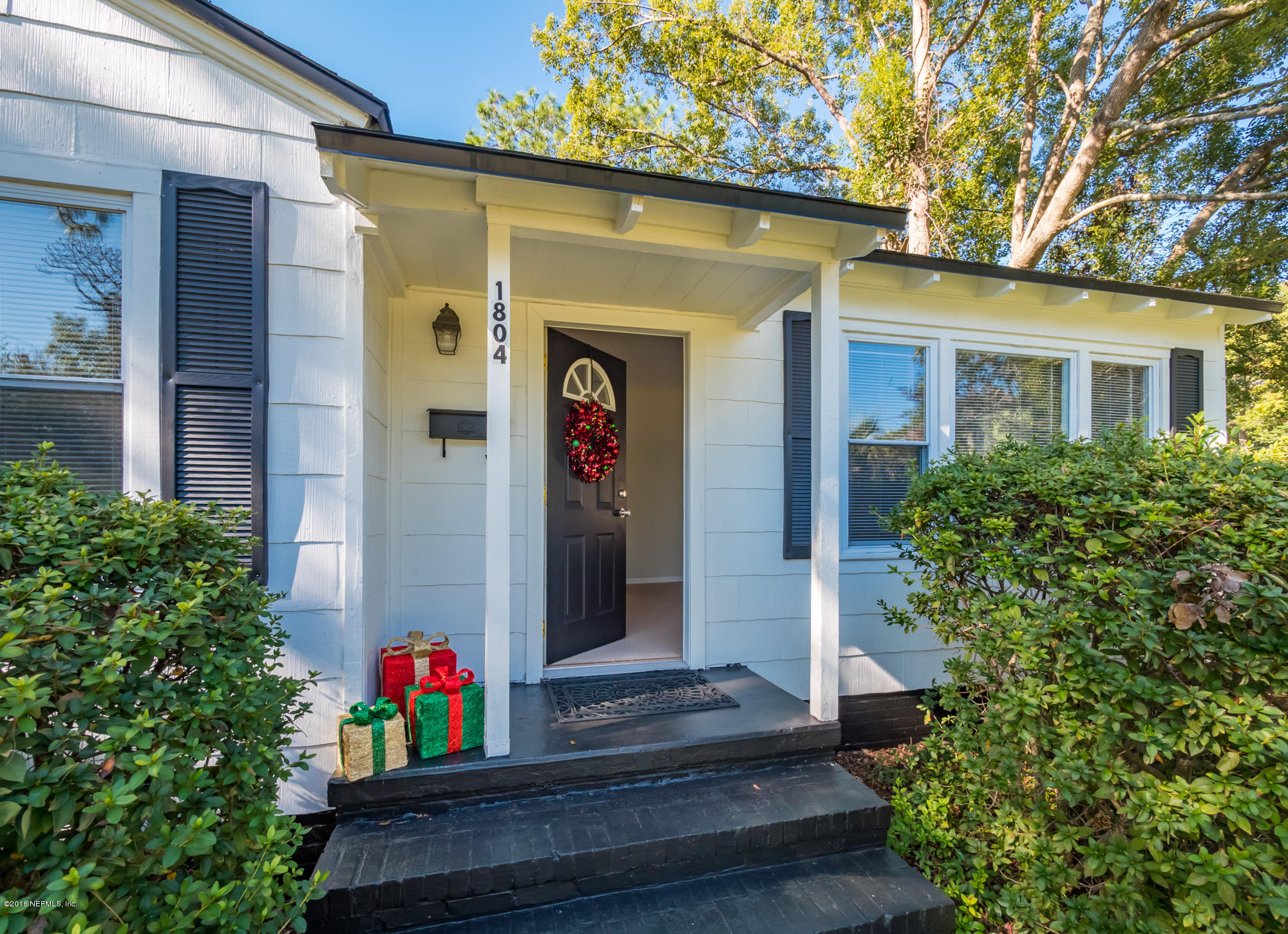1804 Mayfair Road Jacksonville, FL 32207 - Photo 3 of 26 a front view of a house with flowers