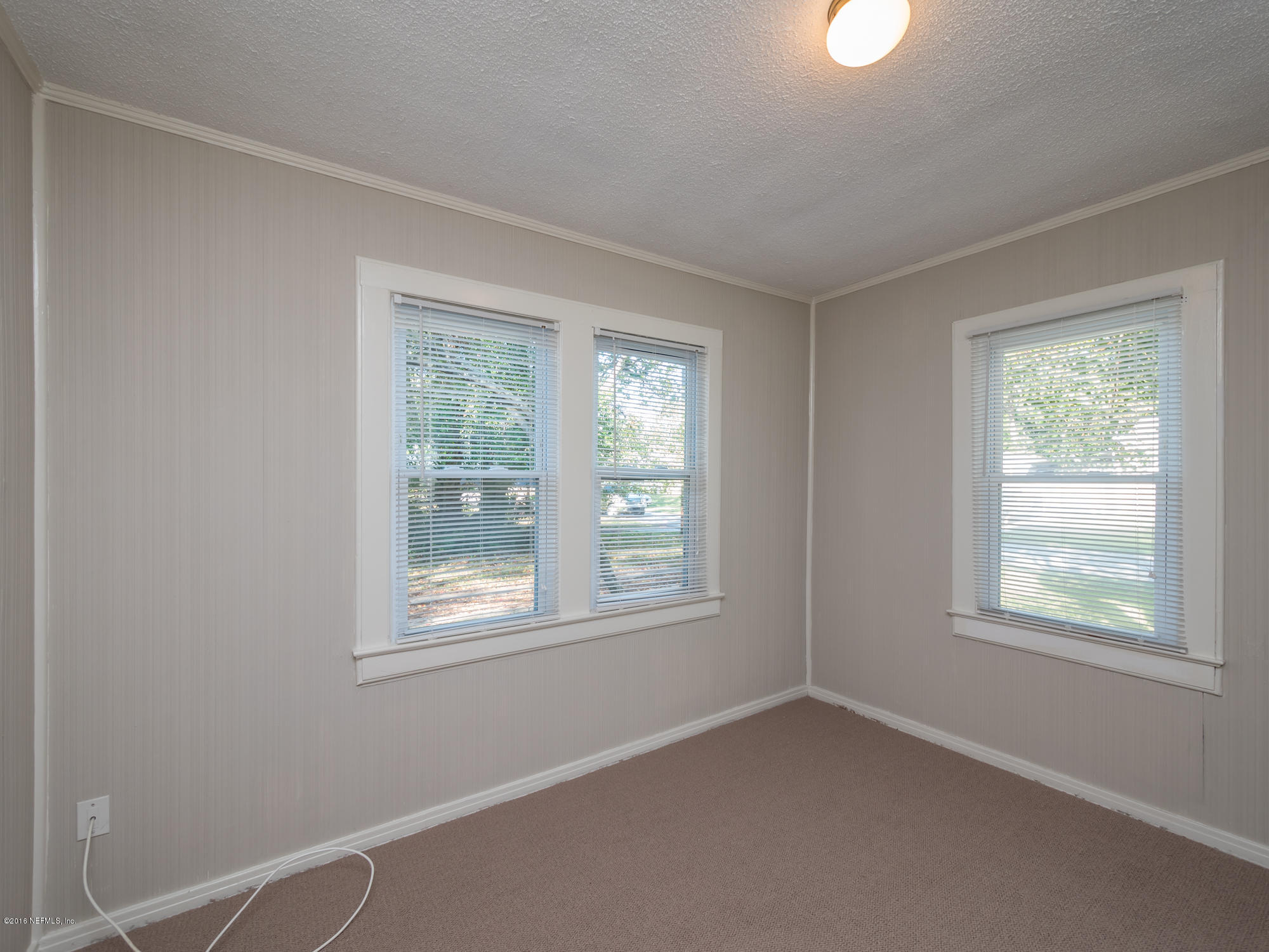 1804 Mayfair Road Jacksonville, FL 32207 - Photo 7 of 26 an empty room with windows