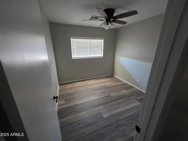 a bathroom with a double vanity sink toilet and shower