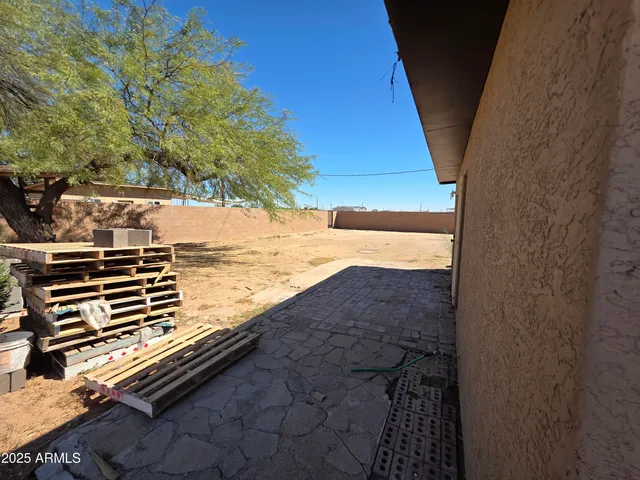 a view of a backyard of the house