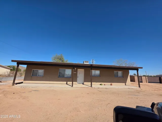 a front view of a house with parking