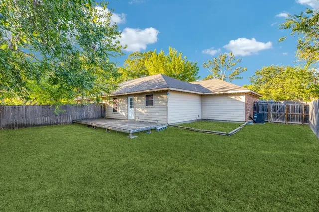 a backyard of a house with lots of green space