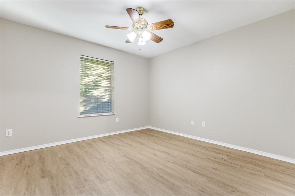 204 Gerrish Street McKinney, TX 75069 - Photo 9 of 12 an empty room with a window and a fan