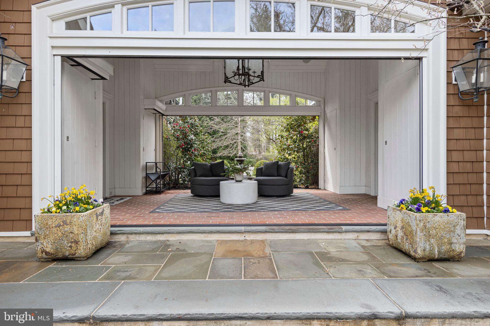 720 Brooke Road Wayne, PA 19087 - Photo 47 of 70 a view of front door of house with outdoor seating