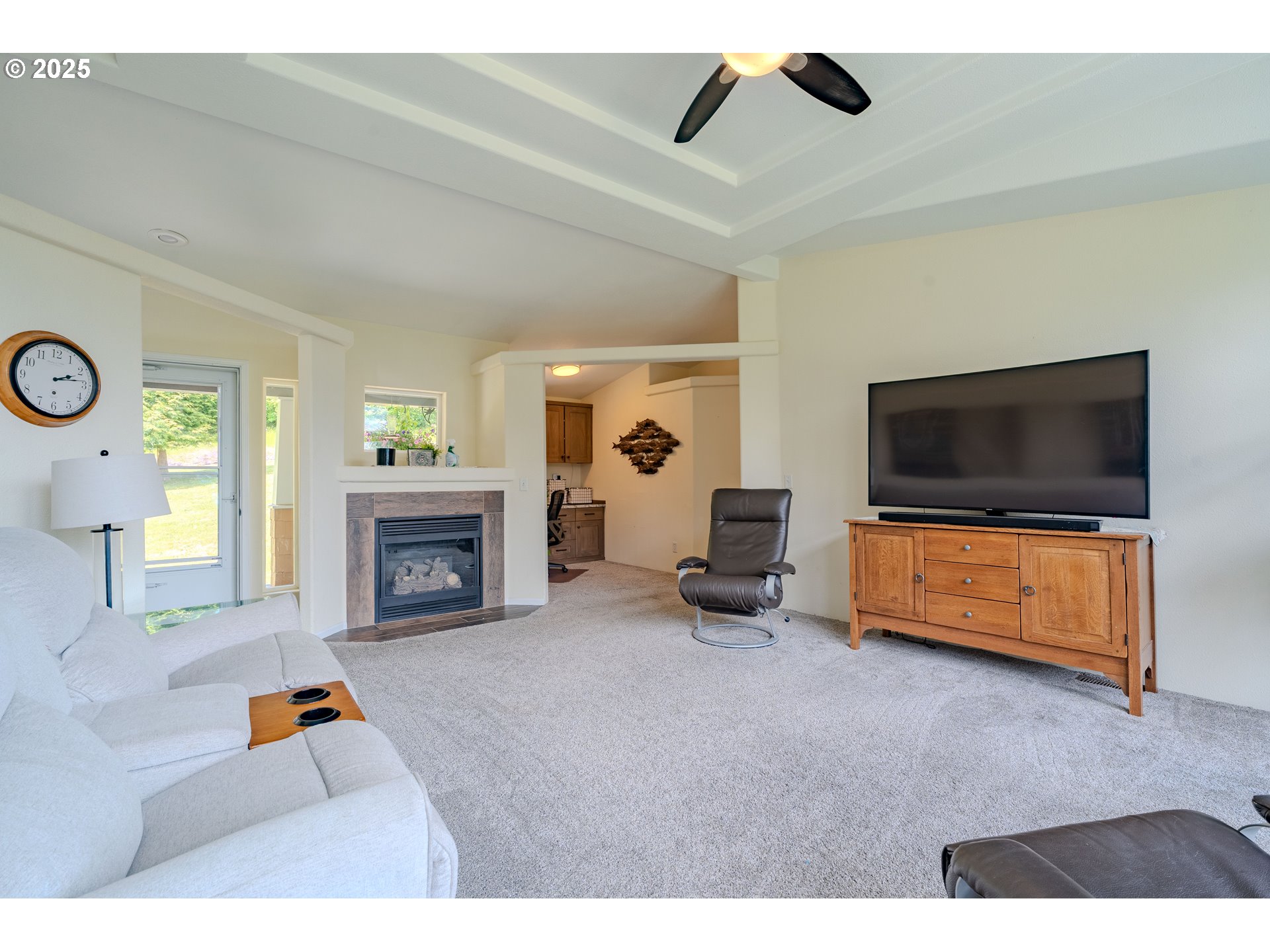 28703 Northeast Lookout Road Camas, WA 98607 - Photo 5 of 33 a living room with furniture and a flat screen tv