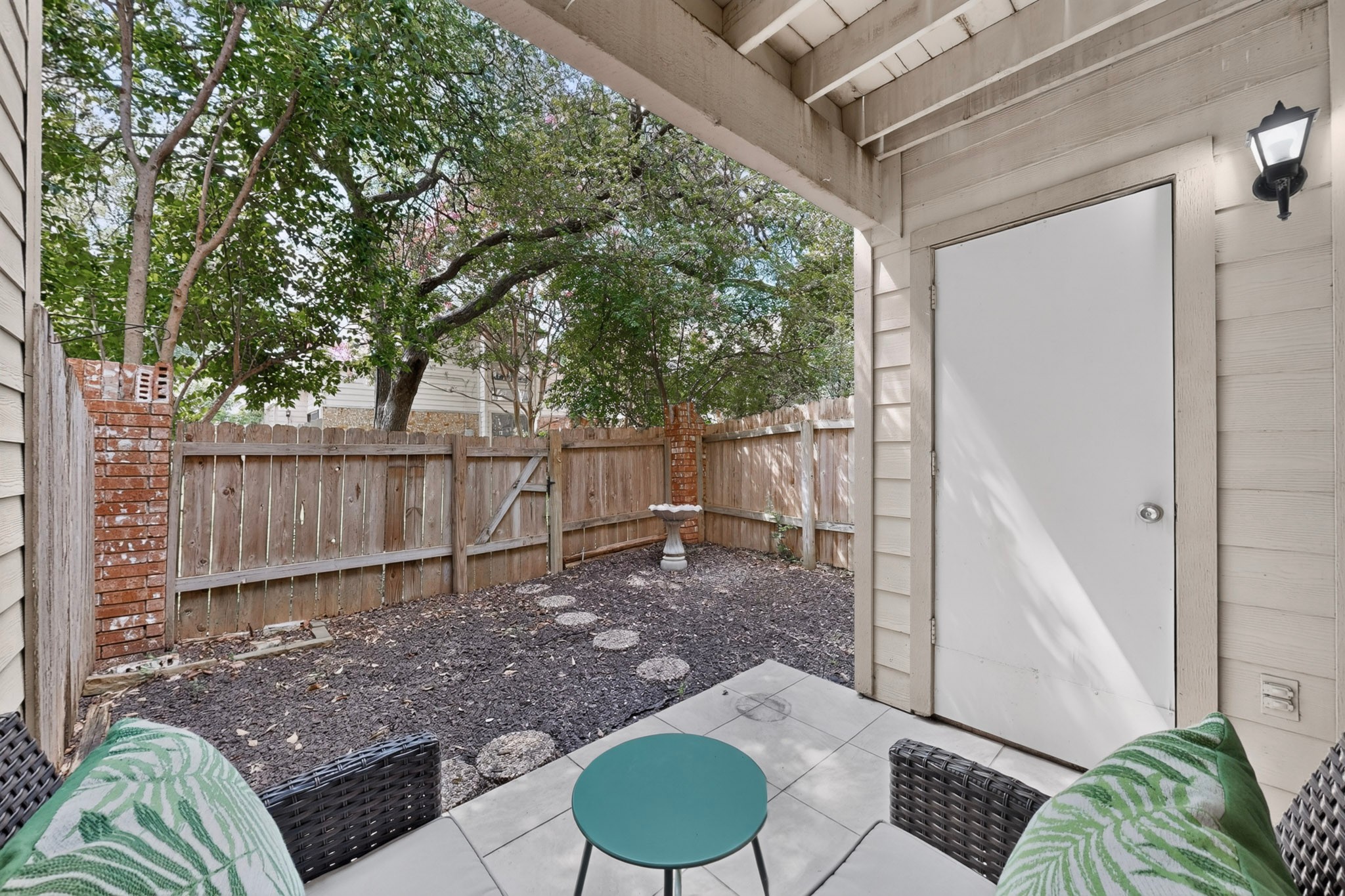 3801 Menchaca Road, Unit 25 Austin, TX 78704 - Photo 23 of 27 Private fenced back patio with storage utility closet