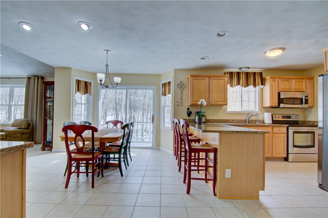 188 Ridge Drive Exeter, RI 02822 - Photo 12 of 40 Breakfast Area off Kitchen. Sliders to Deck. Granite counters in Fully Applianced Kitchen.