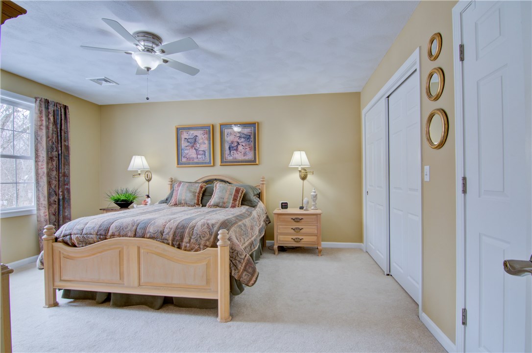 188 Ridge Drive Exeter, RI 02822 - Photo 18 of 40 Master Bedroom. Double closet w/built-ins and Single closet. Ceiling fan w/light. Carpeting.