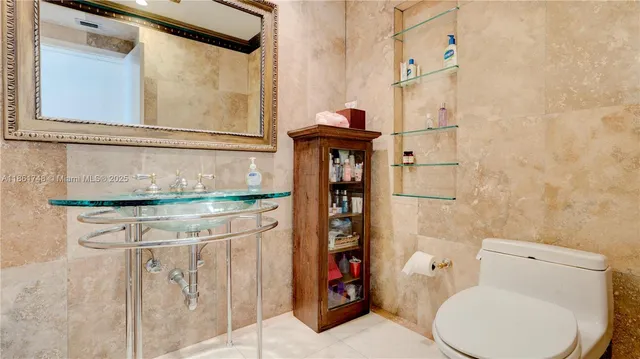 a bedroom with a bed and a dresser with window