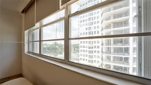 a bathroom with a sink a toilet and shower curtain