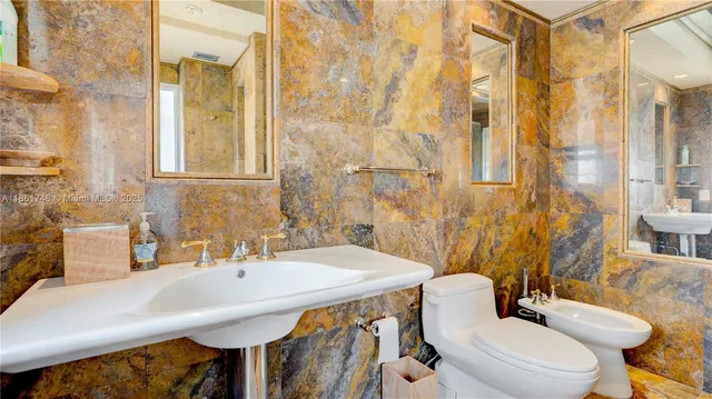 a bathroom with a toilet and shower