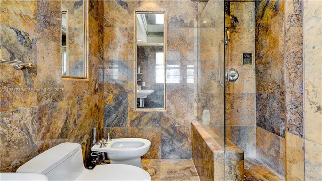 a view of balcony with a floor to ceiling window and brick wall