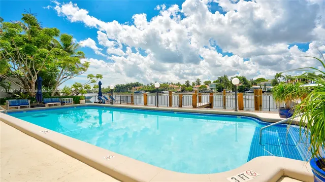 a patio with yard glass top table and chairs