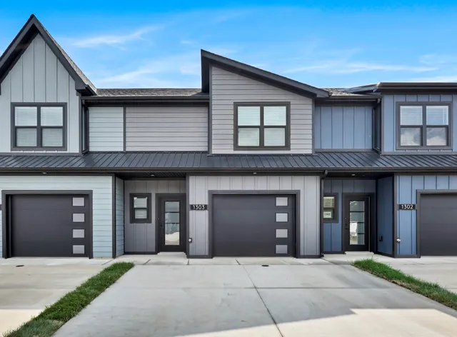 a front view of a brick house with many windows