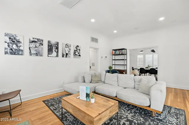 a living room with furniture and a rug