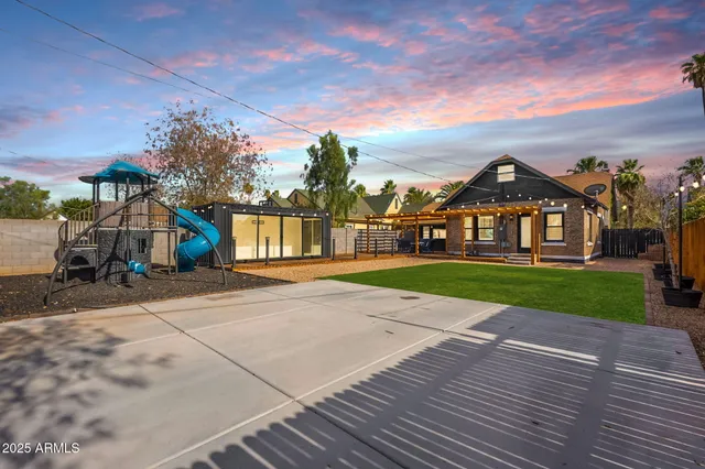 a view of house with a yard
