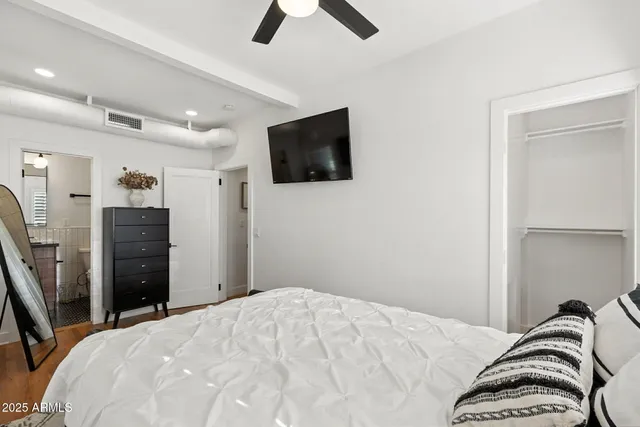 a view of a patio with table and chairs and wooden floor